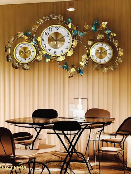 A statement piece for any large wall, this three-dial clock combines practicality with ornate, handcrafted design.