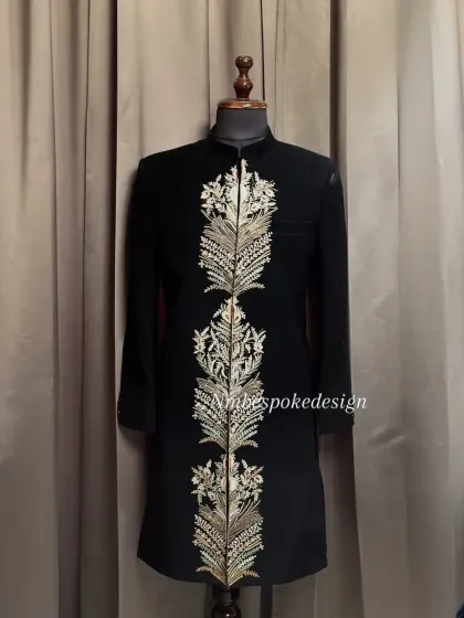 Another view of the feather-embroidered indowestern, showing the detail against a different background.