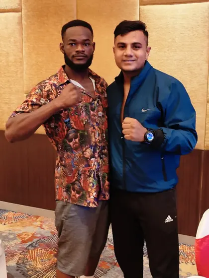 With the African Lion, Eliasu Sulley. I love connecting with fighters from all over the world and sharing our passion for the sport.