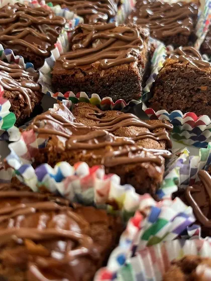 These bite-sized fudgy chocolate Nutella brownies are perfect for sharing. Each one is drizzled with more Nutella because you can never have enough.
