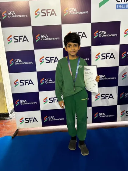 Keshva Vasudev of our academy with his certificate after securing the 2nd position in the SFA Championships in Delhi. We encourage participation in a wide range of championships to build versatile and resilient players.