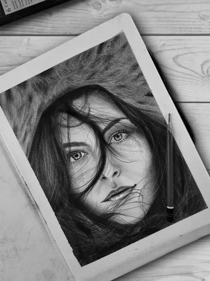 The first drawing in a new sketchbook. This portrait of a woman with windblown hair was a great way to break in the paper, focusing on dynamic hair texture and an intense gaze.
