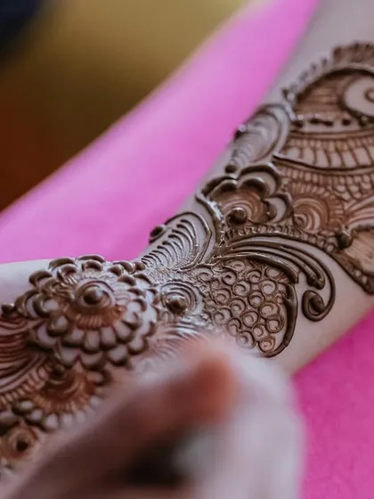 A close-up of the intricate Mehendi design, a beautiful and essential part of the bridal journey. I ensure every tradition is honored with beauty and care.