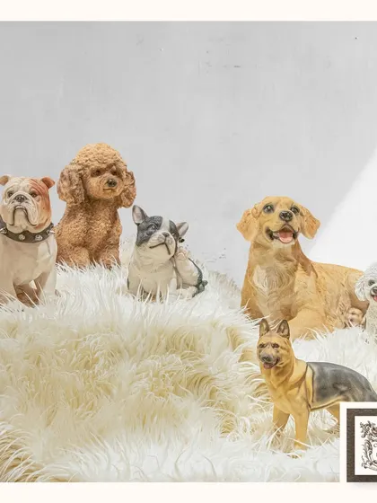 I curated this collection of dog figurines for the ultimate dog lover. Featuring various breeds like bulldogs, poodles, and German shepherds, they create a charming and personalized display.