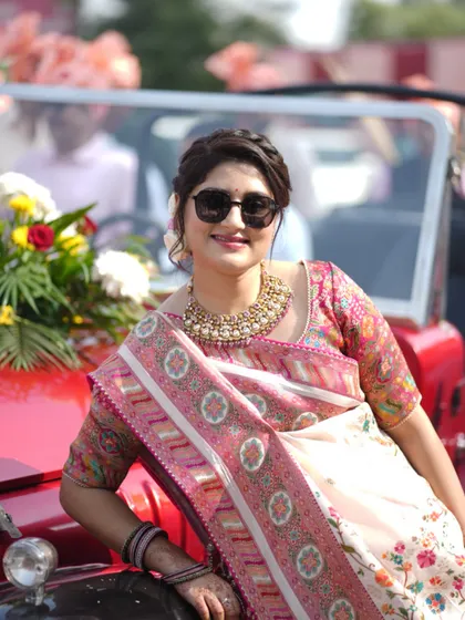 A guest enjoying the baraat from a vintage car. I make sure to capture not just the couple, but also the friends and family who make the day special.