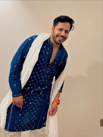 Another confident pose in the blue kurta. The variety of shots shows how I can present myself in different ways for promotional material.