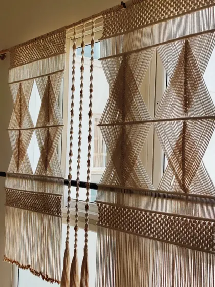 This is one of the most challenging and rewarding pieces I've ever made. It's a large macrame partition, designed with a precise geometric diamond pattern to divide a living space while keeping it bright and airy. Creating such a large, intricate piece required so much focus, but seeing it transform a room makes all the effort worthwhile.
