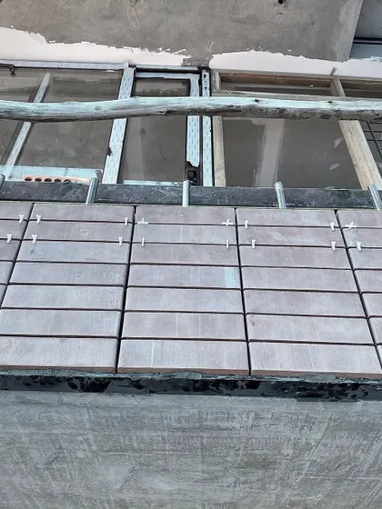 On-site progress of the facade cladding for the Jayanagar house.