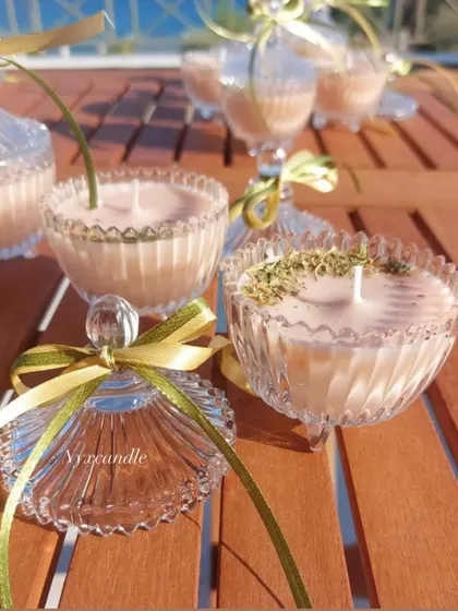 A close-up of the crystal jar candle, a perfect keepsake for wedding guests.