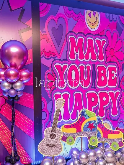 A colorful and funky backdrop with retro 70s graphics, a disco ball, and props like a glittery guitar and roller skates.