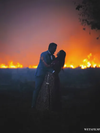 Sometimes, the most unplanned moments create the most dramatic shots. We spotted a fire in the distance and seized the opportunity for this breathtaking silhouette. It shows our ability to think on our feet and create unique, powerful pre-wedding images.