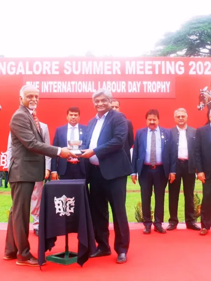The Chairman, Mr. R. Manjunath Ramesh, presents The International Labour Day Trophy to the owners of Ziva.