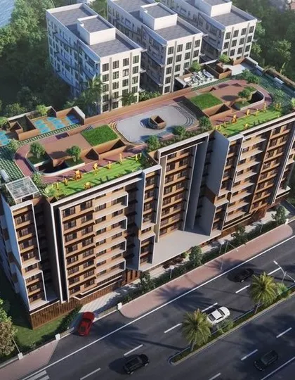 An aerial rendering of a mid-rise apartment complex, showing the building's footprint, rooftop amenities, and proximity to a river and green spaces.