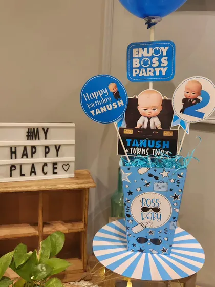 It's all in the small details! A themed centerpiece next to our "My Happy Place" sign.