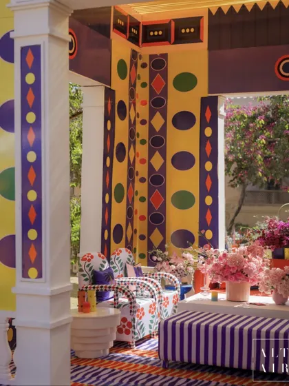 A bold and graphic photo booth from 'The Roots' Mehendi. The space was a living canvas, layered with saturated hues and joyful patterns that paid homage to African visual heritage.