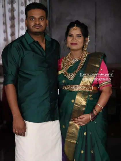 A beautiful couple portrait from their baby shower event. The mom-to-be is wearing a classic temple jewellery set.