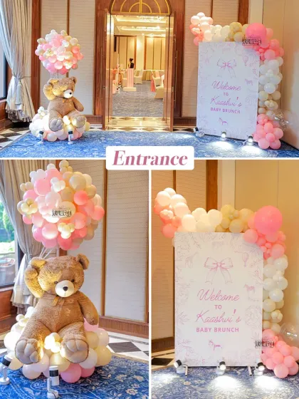 The entrance to Kaashvi's baby brunch featured a personalized welcome sign and a giant teddy bear holding a bouquet of balloons, creating a grand and inviting first impression.