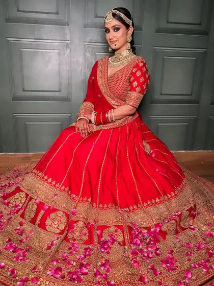 Another beautiful shot of this bride, looking serene and regal. The way the lehenga spreads out creates a truly royal portrait.