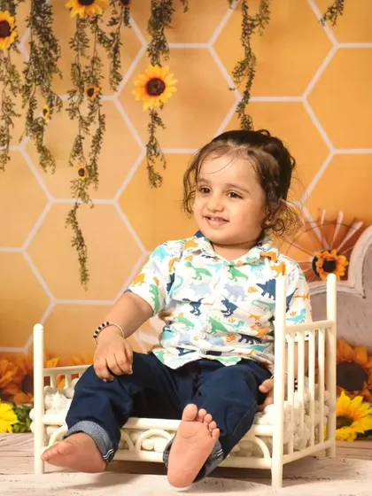 A collection of candid and playful moments from a sunflower-themed session, showing a range of expressions from curious to joyful.