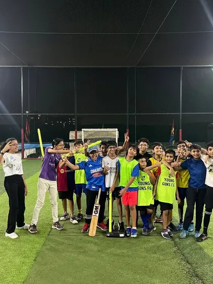 The winning team! A group of happy kids posing with their bats and gear after a fun-filled cricket tournament.