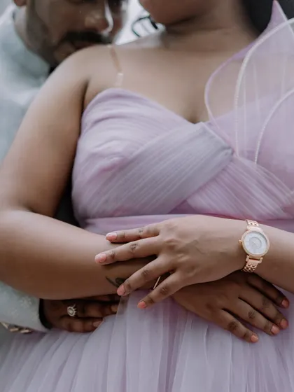 An intimate close-up showing the delicate details of our lilac 'Gorgina' gown. The one-shoulder design with its structured floral element is both modern and romantic.