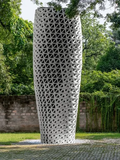 The VERTO prototype, installed in New Delhi's Sunder Nursery Park, stands as a functional sculpture. Its twisting form and perforated skin are the result of CFD analysis to optimize airflow and purification effectiveness.