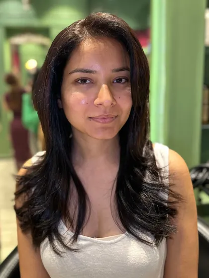 The final result of the classy, effortless haircut. It's a simple change that makes a big impact, leaving the hair looking healthy and stylish.