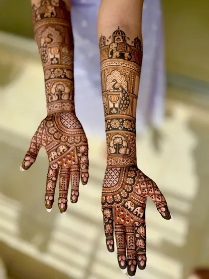 Another perspective of this intricate bridal design, highlighting the detailed work on the back of the hands.