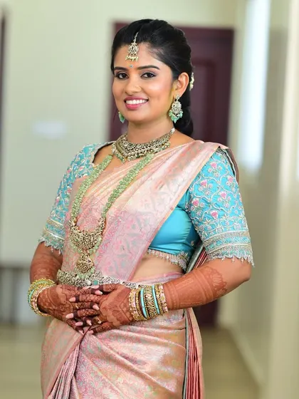 The bride looking confident and radiant in her complete ensemble, a perfect look for her special day.