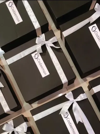 A look at our elegant, branded gift boxes for Codaemon. The simple black and white theme exudes professionalism and is perfect for employee appreciation or client gifting.