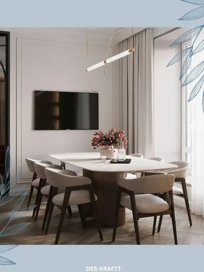 A clean and modern dining area with a white marble-topped table and soft grey chairs, illuminated by a contemporary linear light fixture.
