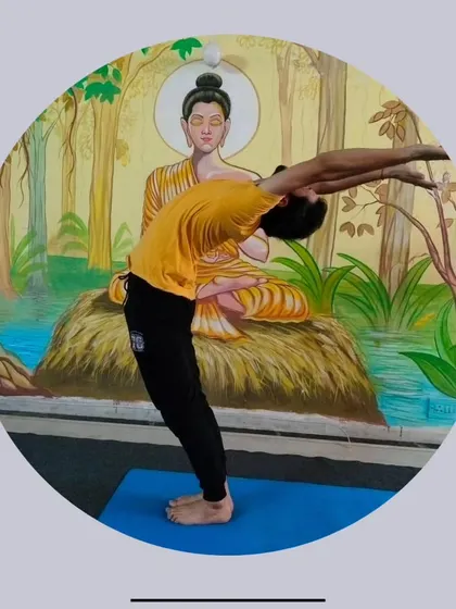 A demonstration of Ardha Chakrasana, the standing half wheel pose. This is a more accessible backbend that we often practice in our Hatha yoga group sessions.