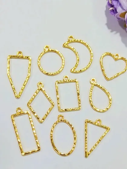 Our textured bezels are perfect for adding extra detail to your pendants and charms. This pack of 10 assorted shapes in a gold finish offers great value and variety for your projects.