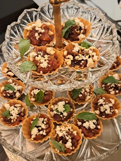 These little tarts are an absolute treat for any occasion. The combination of sweet balsamic tomatoes, caramelized onions, and salty feta in a crisp pastry shell makes for a perfect bite sized appetizer for tea parties or gatherings.