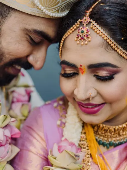 What blush pink dreams are made of. This bride is surrounded by lotus flowers for her ceremony, and her makeup reflects that beauty with soft pink tones on the eyes and lips.