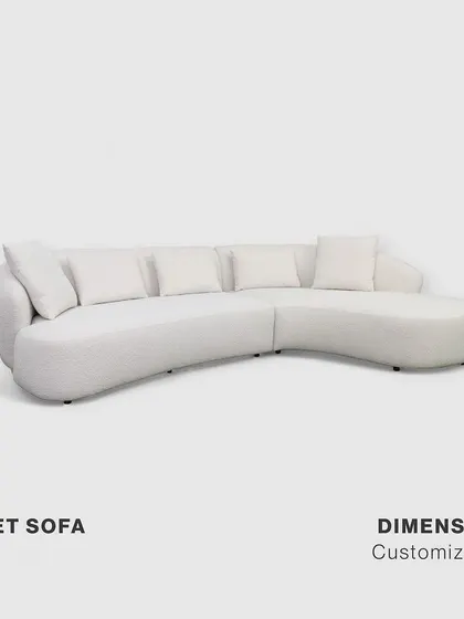 A studio view of the customizable Poet Sofa. Its clean, organic lines and kidney-shaped design are evident, showcasing a form that is both sophisticated and inviting. This piece is available in multiple configurations to perfectly suit your living space.