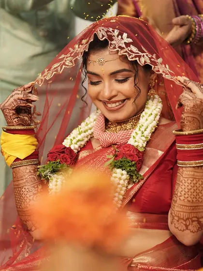 A classic shot of the bride under the veil. The makeup is soft and romantic, with a focus on enhancing her features in a very natural way.
