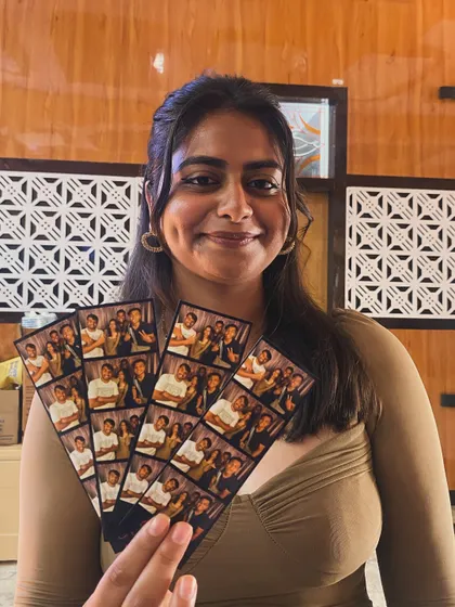 A fan of photo strips showing off her collection from the day's event. Unlimited prints means you can try all the poses you want!