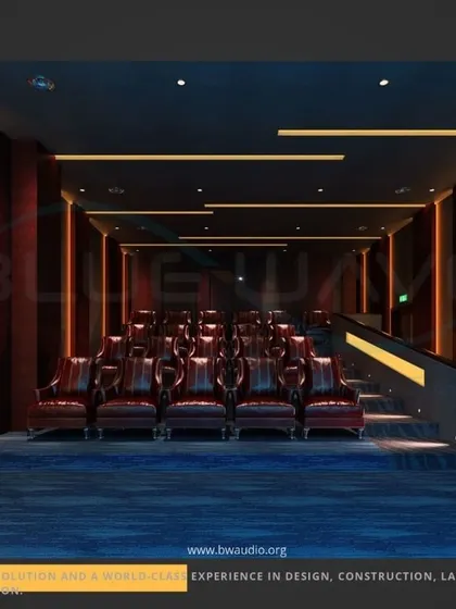 A long-shot view of a modern theater, showcasing the multi-level tiered seating and vertical accent lighting. This design is ideal for larger rooms, ensuring everyone has an unobstructed view and an immersive experience.