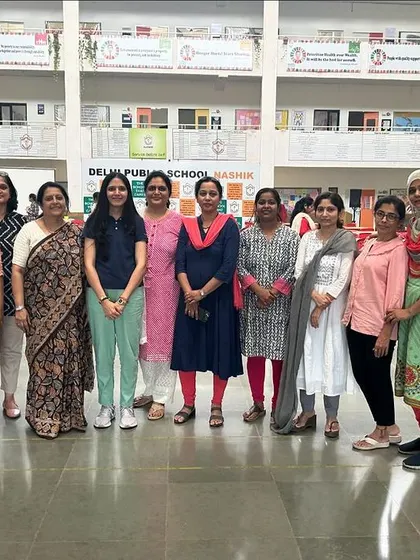 Posing with a smaller group of teachers at DPS Nashik. I value the personal connections I make during these training sessions.