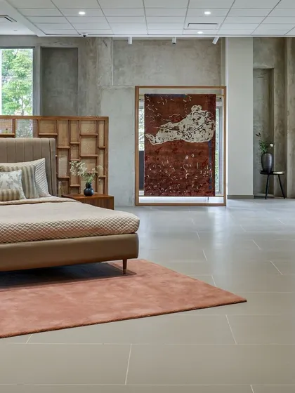 The perfect balance of natural and artificial light gives the showroom an inviting and warm feeling. We designed the upper floor with large windows and a neutral palette to create an airy, gallery-like atmosphere for the bedroom displays.