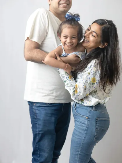 A candid moment of laughter and hugs. These spontaneous interactions are what make family photoshoots so special.
