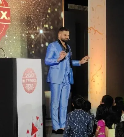 A close-up of my performance for the Terex corporate event, showing my focus and stage presence while interacting with the audience.