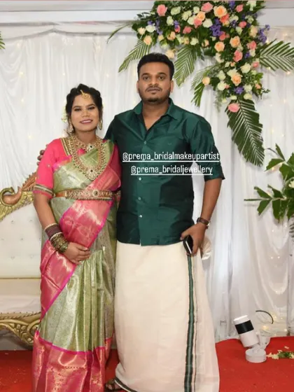 A full-length shot of the couple at the baby shower.