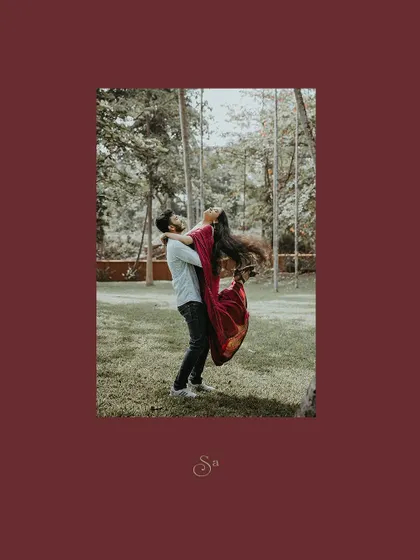 A joyful lift, with the bride-to-be's red dress creating a beautiful sense of movement.