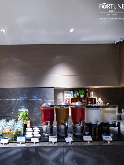 A selection of fresh juices and traditional Indian beverages like lassi and buttermilk, providing a refreshing accompaniment to your breakfast.