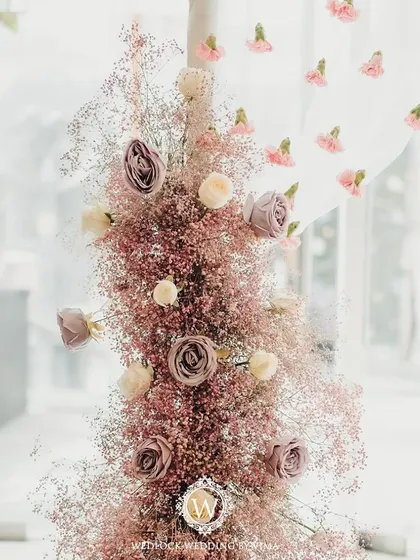 A closer look at the details from a pastel Mehendi. We used delicate floral arrangements, custom welcome signs, and sheer curtains with tiny flowers to create a soft and romantic atmosphere.