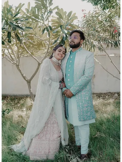 A lovely outdoor shot of the couple. The bride's natural-looking makeup and elegant hairstyle are timeless.