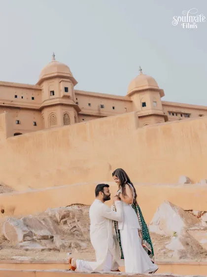 A classic proposal shot during a pre-wedding session in Jaipur. Set against the ancient walls of the fort, this moment feels both grand and deeply personal.