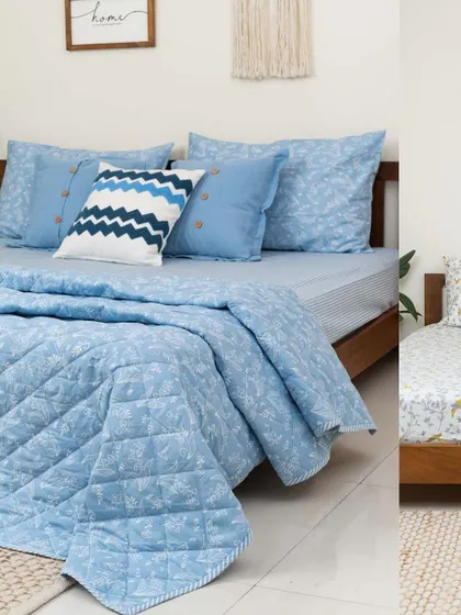 For the love of blue. This collage showcases our blue 'Forest Canopy' quilt and bedsheet set, paired with a chevron-patterned cushion cover. It's a perfect example of how to layer different prints and textures within the same color family.